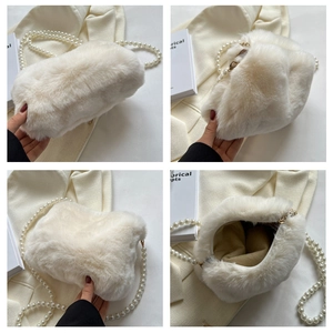 Detail view showing soft cream plush fabric and elegant pearl strap on the handbag