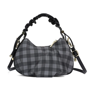Gray checkered cloud handbag with pleated handle and golden zipper on white background