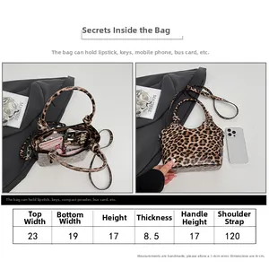 Size chart and interior capacity view of leopard print handbag with dimensions and strap info