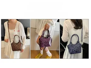 Detailed view of leopard print handbags in brown pink and purple with adjustable straps