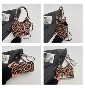 Detail view of leopard print bucket bag with adjustable straps and wide base structure