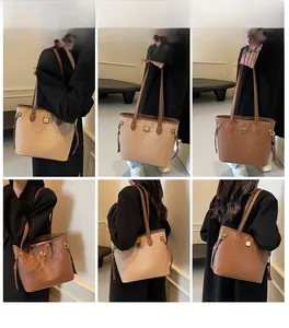 Detailed model shots of large woven tote bag in beige and brown with metal buckle