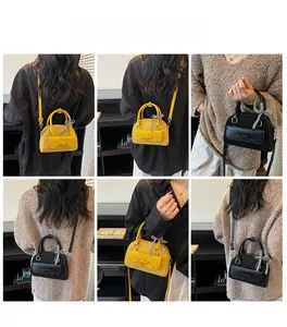 Vue multi-angle du sac Boston élégant avec nœud et poignée en soie en noir et jaune