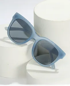 Detail of matte grey-blue oversized sunglasses with UV400 and computer protection