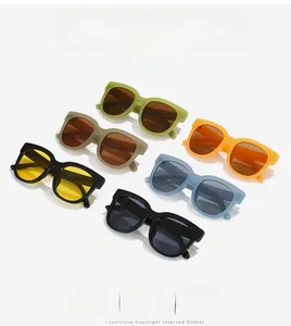 Flat lay of colorful oversized square sunglasses in green, brown, orange and blue