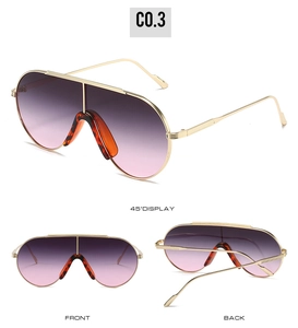 Close-up of pilot style sunglasses with gold metal frames and purple gradient lenses