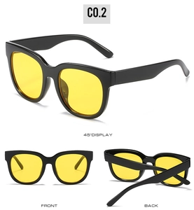 Three-angle display of oversized retro sunglasses with black frames and yellow lenses