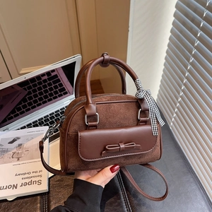 Brown vintage faux suede underarm bag with ribbon bow and elegant shoulder strap