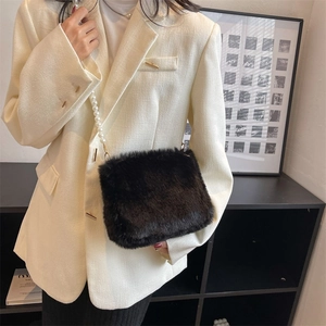 Chic black faux fur shoulder bag with white pearl chain strap and gold hardware accents