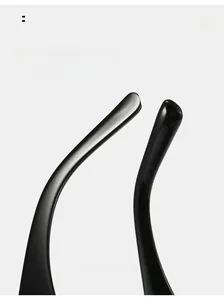 Detail of curved black glossy sunglasses temples showing ergonomic arc for comfortable wear
