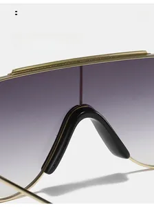Macro detail of ergonomic nose pads and golden metal frame on gradient purple sunglasses