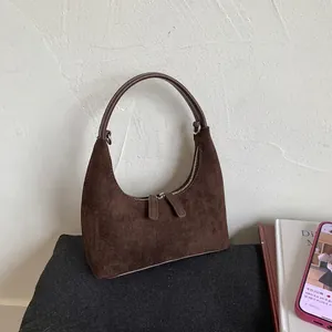 Deep brown matte suede crescent handbag with retro half-round shape and circular handle