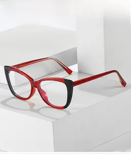 Detail of cat-eye TR90 glasses frame featuring red and black color-blocking design