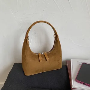 Brown suede hobo shoulder bag with smooth leather strap and dual zipper closure for women