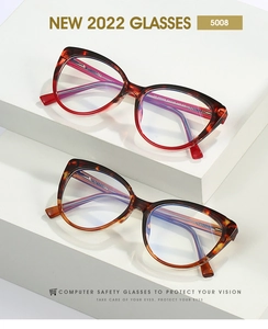 Detail of TR90 cat-eye glasses frames in red and brown tortoise shell patterns
