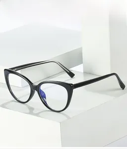 Detail of black cat-eye TR90 frames with blue light blocking lenses on white stone base