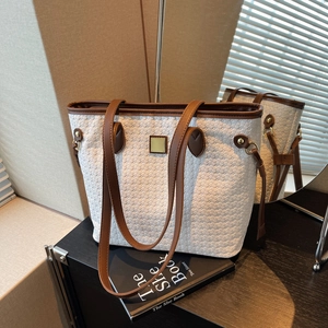 Retro woven tote bag in cream white with brown leather handles and gold buckle