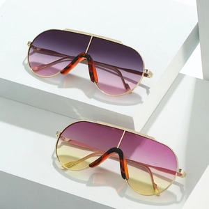 Modern gold pilot sunglasses with gradient lenses and clear oval frames for men and women