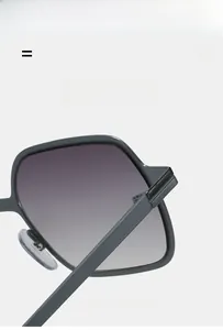 Detail of square sunglasses showing hinge, silicone nose pads, and elastic texture