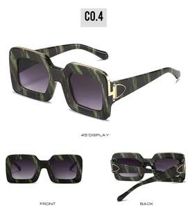 Three perspectives of green marble square sunglasses with gradient purple lenses