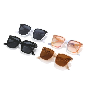 Square oversized sunglasses with metal studs in four colors on a white background