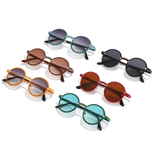 Set of retro round sunglasses in multiple vibrant colors on a clean white background