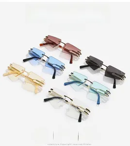Flat lay of rimless cat-eye sunglasses in six various vibrant lens colors with gold metal frame