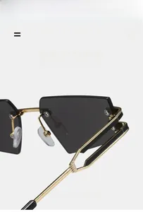 Detail of cateye rimless sunglasses showing double-layer hollow golden metal temples