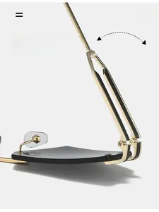Detailed close-up of durable golden metal hinges on cat-eye rimless sunglasses