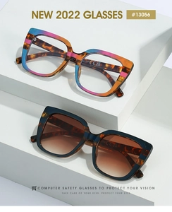 Detail of oversized cat-eye sunglasses with gradient frames and tortoise shell patterns