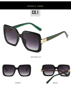 Detail view of square sunglasses with gold accents and tri-color stripes on temples