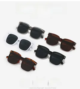 Flat lay of oversized square sunglasses in five colors including amber and leopard print