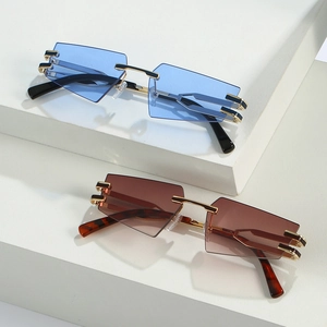 Modern rimless cat eye sunglasses with geometric lenses in blue and brown color options
