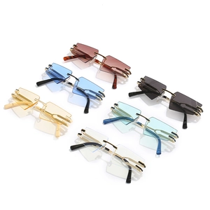 Frameless cat-eye geometric sunglasses in multi-color metallic frames with tinted lenses