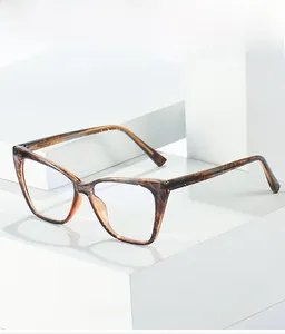 Detailed view of tortoiseshell cat-eye frames with textured material and clear lenses
