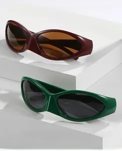 Detail of retro oval sports sunglasses in burgundy and dark green with wrap design