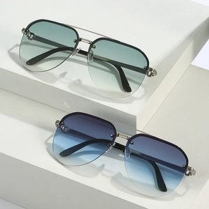 Retro pilot sunglasses with double-bridge metal frames and gradient blue lenses on white steps