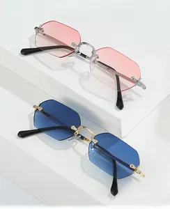 Close-up of rimless octagonal sunglasses with pink and blue gradient lenses