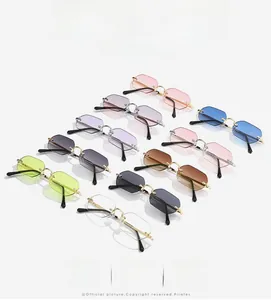 Collection of rimless octagonal sunglasses in various gradient colors with metal temples