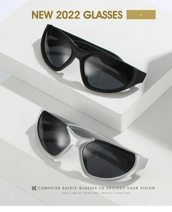 Detail view of sporty futuristic Y2K sunglasses in matte black and metallic silver finishes