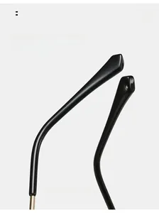 Macro shot of curved ergonomic temples on rimless polygonal sunglasses for stable wear