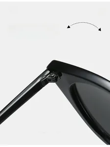 Detail of durable texture metal hinge on black cat-eye sunglasses for women