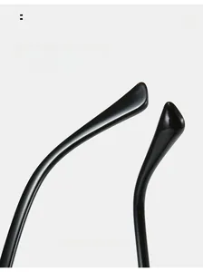 Close-up of curved glossy black temple legs on sunglasses for comfortable fit
