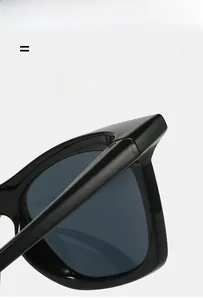 Close-up of flexible black gloss hinges on lightweight polarized sports sunglasses