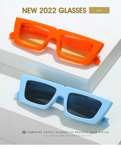 Retro rectangle sunglasses in vibrant orange and light blue on geometric steps