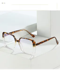 Detail of tortoise and transparent two-tone large square frame glasses with blue light filter