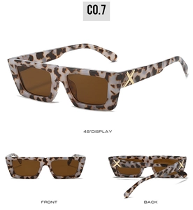 Detail view of retro leopard print sunglasses with golden X decor on temples