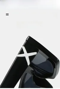 Close-up of retro square sunglasses featuring a distinctive white X-shaped hinge detail