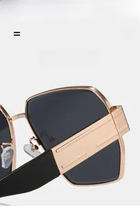 Detail of super elastic rose gold metal hinge on lightweight square sunglasses