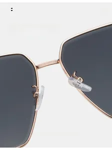 Detailed macro view of comfortable soft silicone nose pads on square metal sunglasses